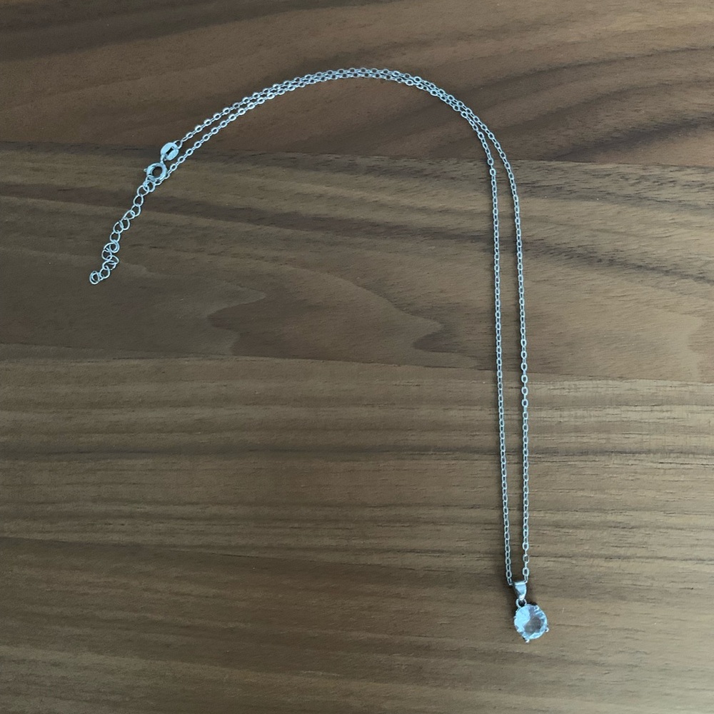 925 silver chain hung with CZ approx 1carat.
Excellent condition.